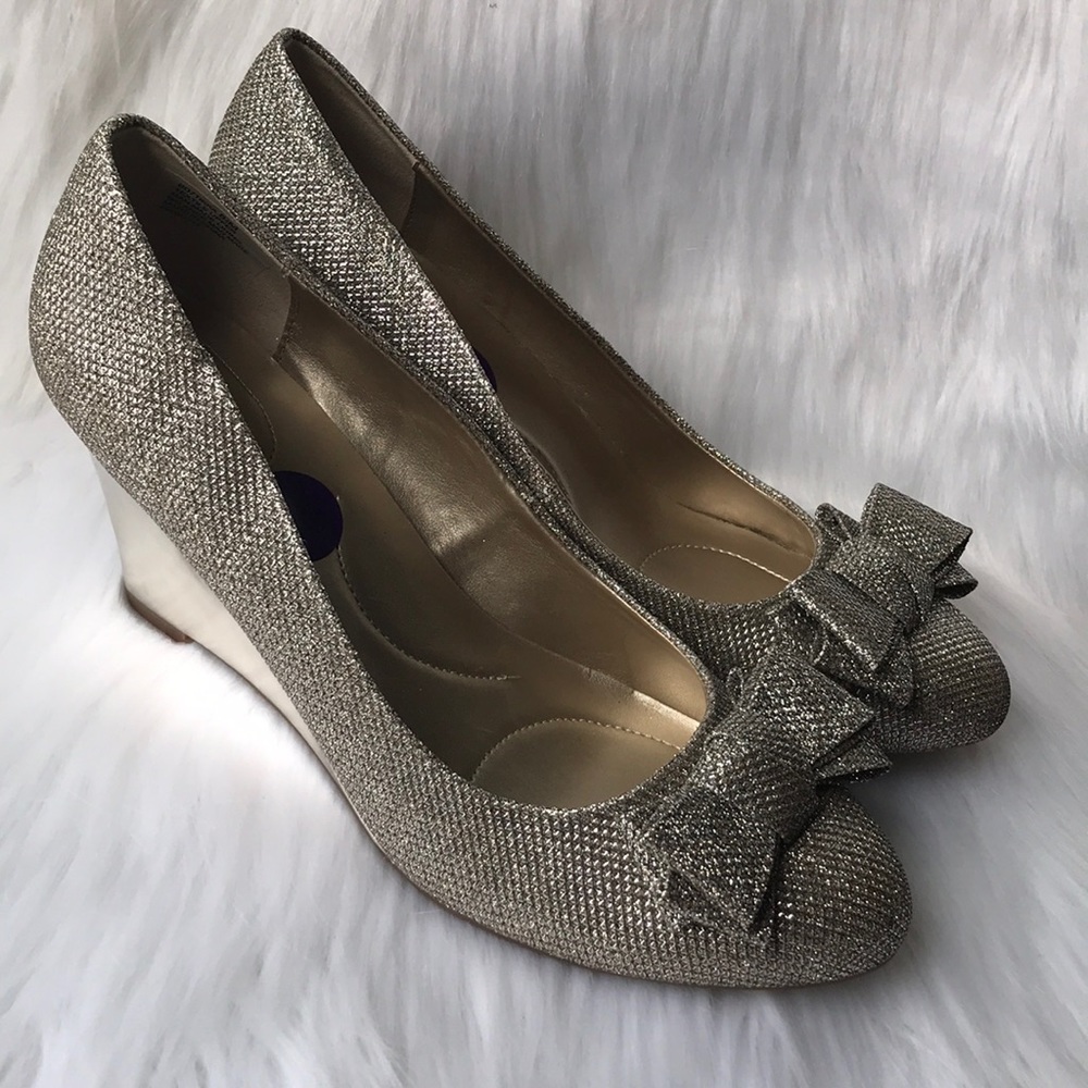 Bandolino woman’s gold high heel wedge size 8.5